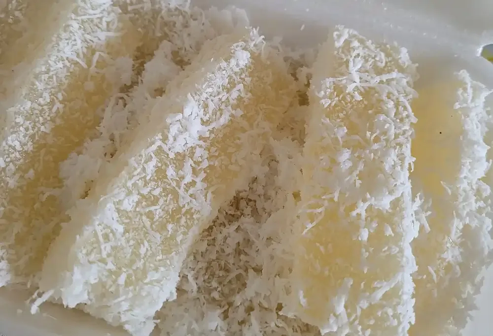 Traditional steamed tapioca kueh coated with grated coconut
