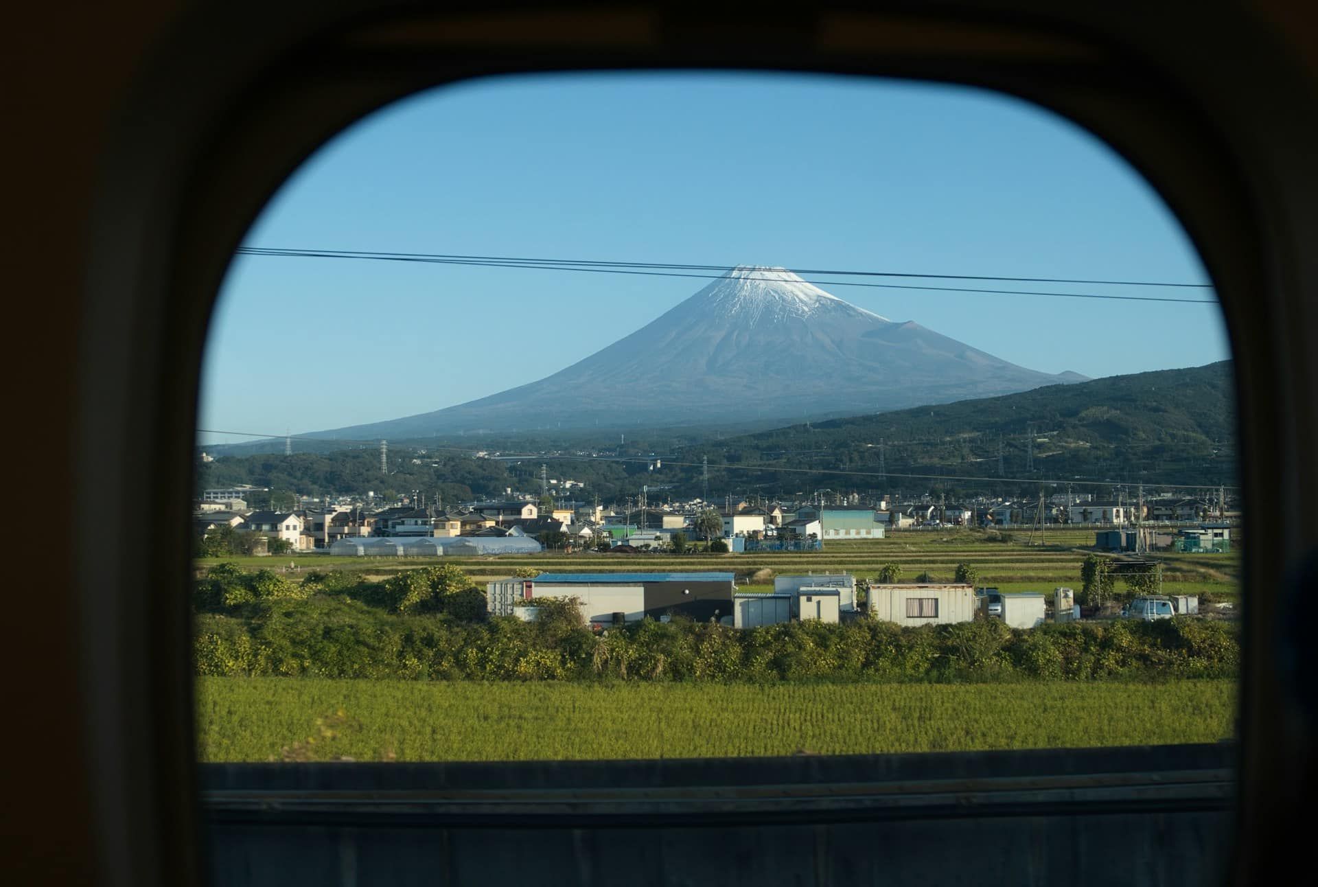 Mount Fuji view from a Shinkansen bullet train window in Japan.