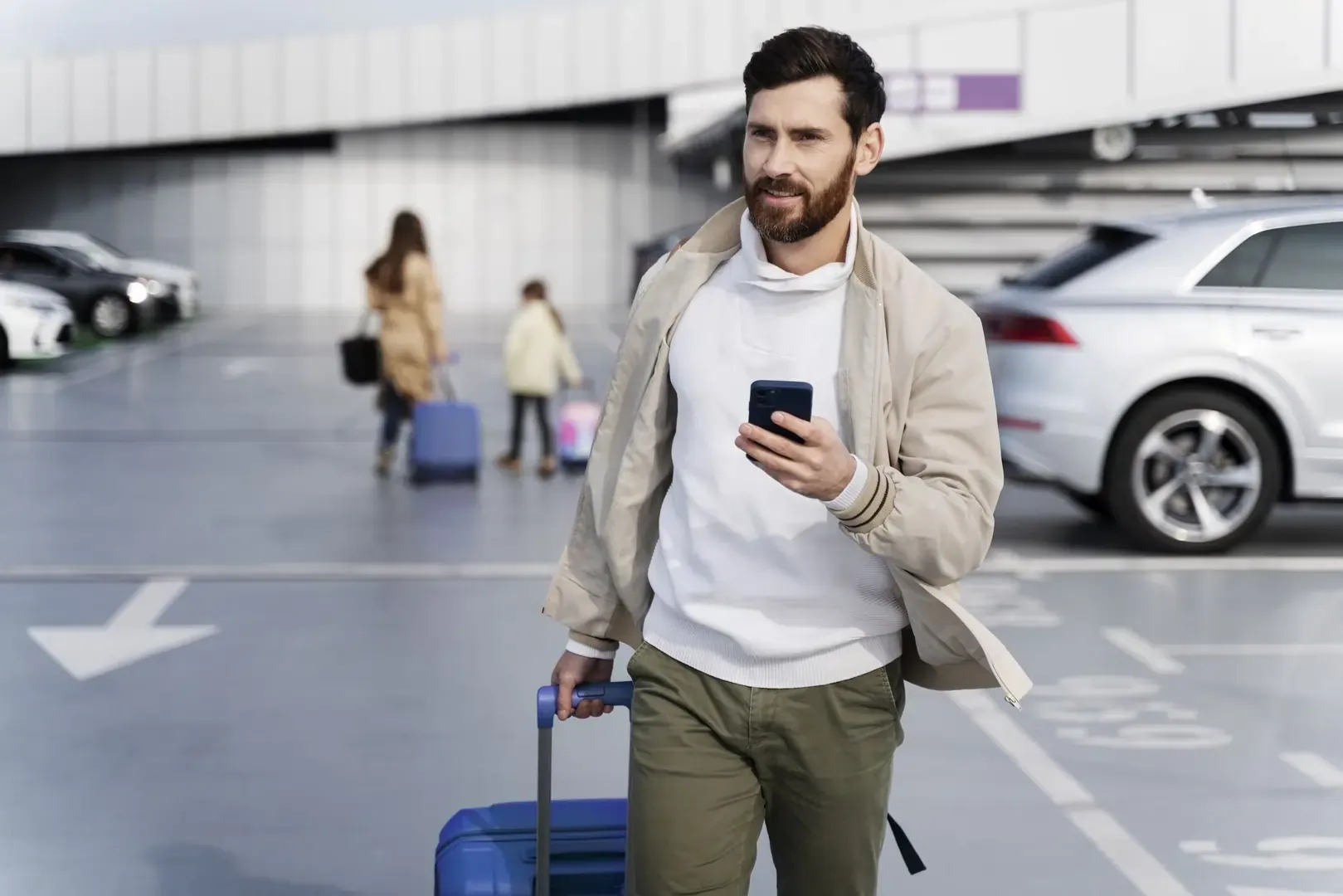 Traveller coming out of airport parking garage and connected to eSIM overseas network