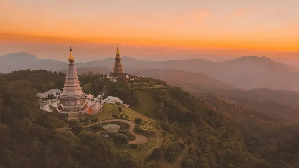 Golden pagodas on a mountain ridge at sunrise in Doi Inthanon National Park, Chiang Mai
