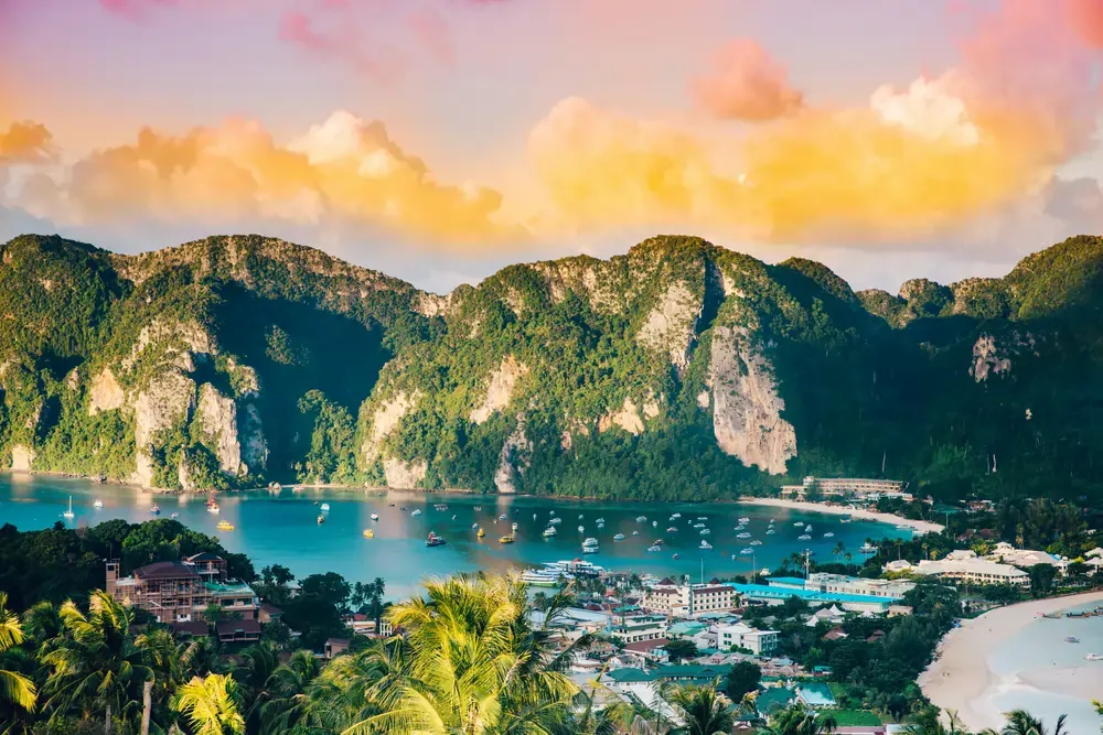 View of Maya Bay's turquoise waters and limestone cliffs on Ko Phi Phi Leh, Thailand.