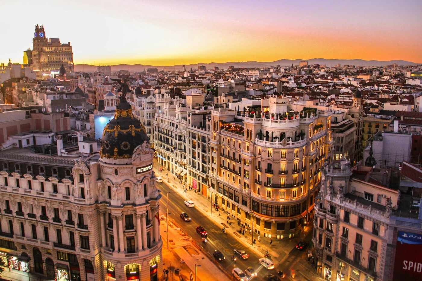 Sunset view over Gran Vía and the historic Metropolis Building in central Madrid