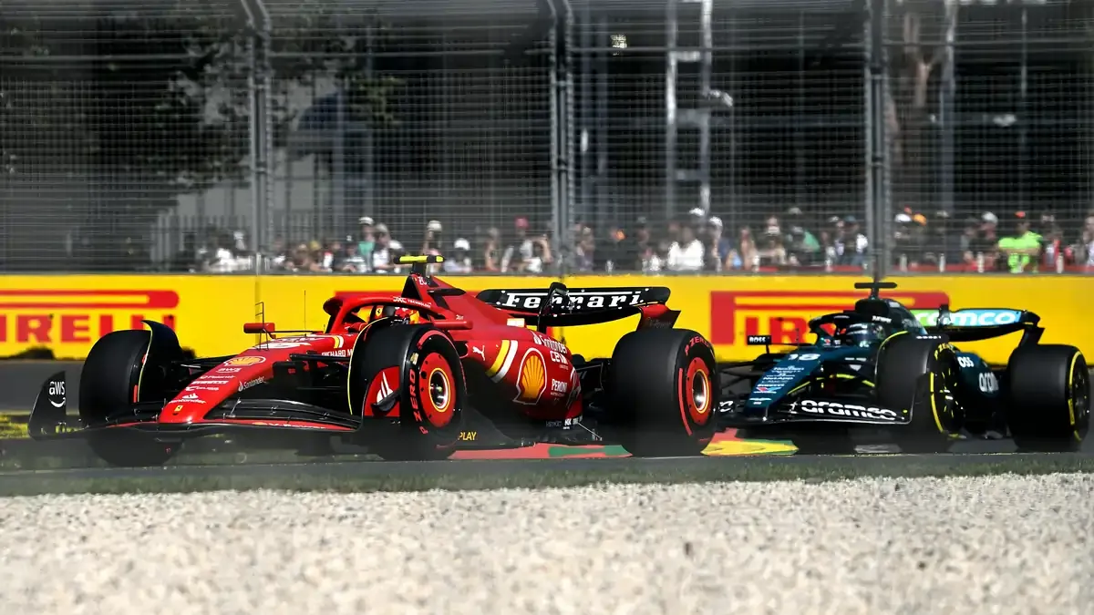Ferrari Formula 1 car battling wheel to wheel with a rival during a Grand Prix race.
