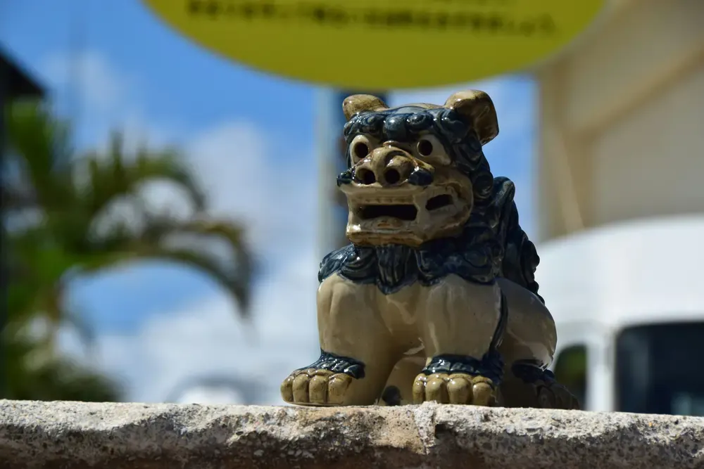 Traditional Okinawan Shisa lion-dog statue under sunny skies