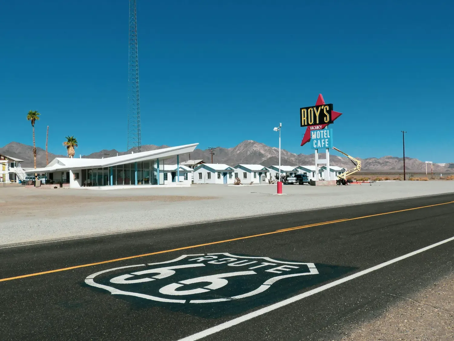 Historic Route 66 highway passing Roy's Motel & Café in Amboy, California, an iconic stop on a classic USA road trip.