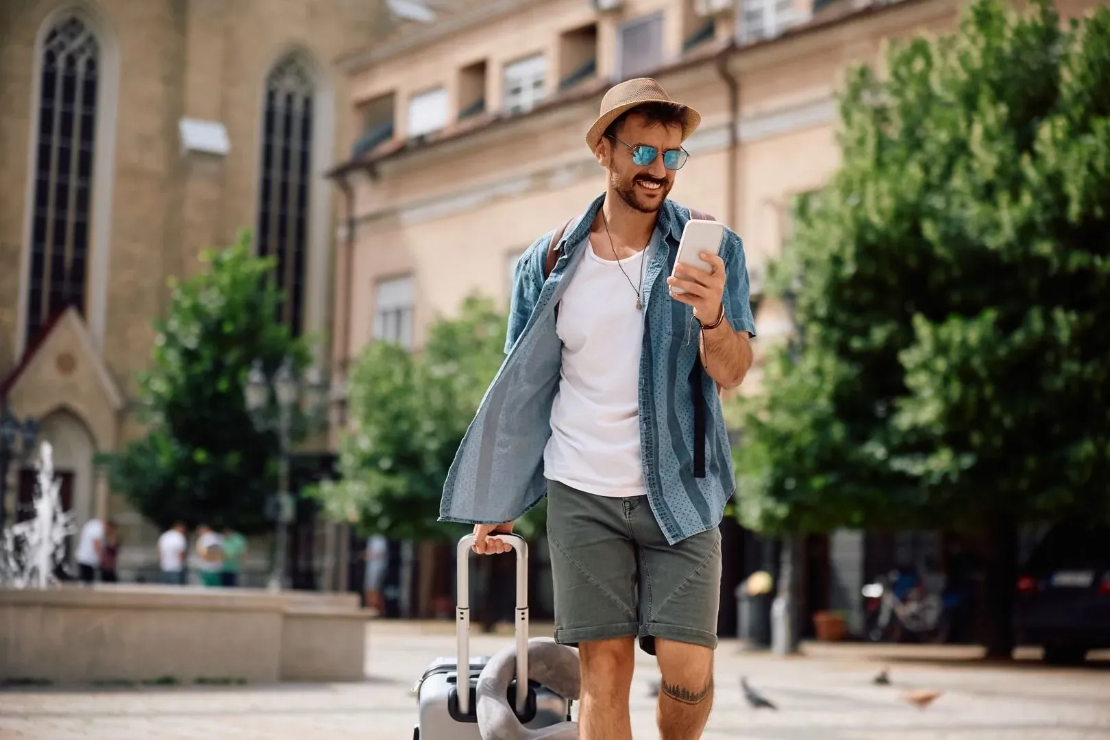 Traveller exploring the city while checking his roaming usage on the go.