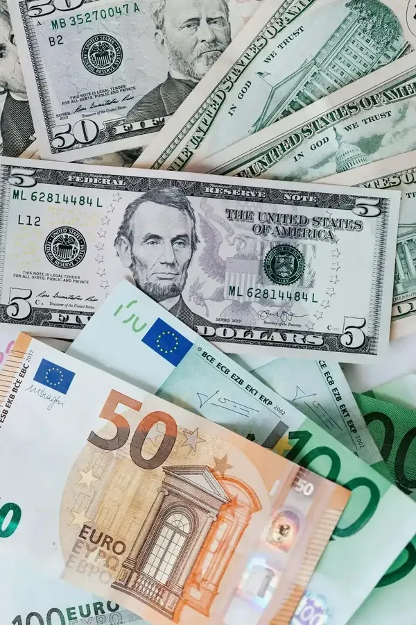 Close-up of various Euro and US Dollar banknotes scattered