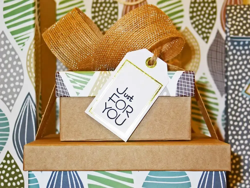Gift box with a 'Just for You' tag — how to buy and send a Nomad eSIM as a digital gift for someone else