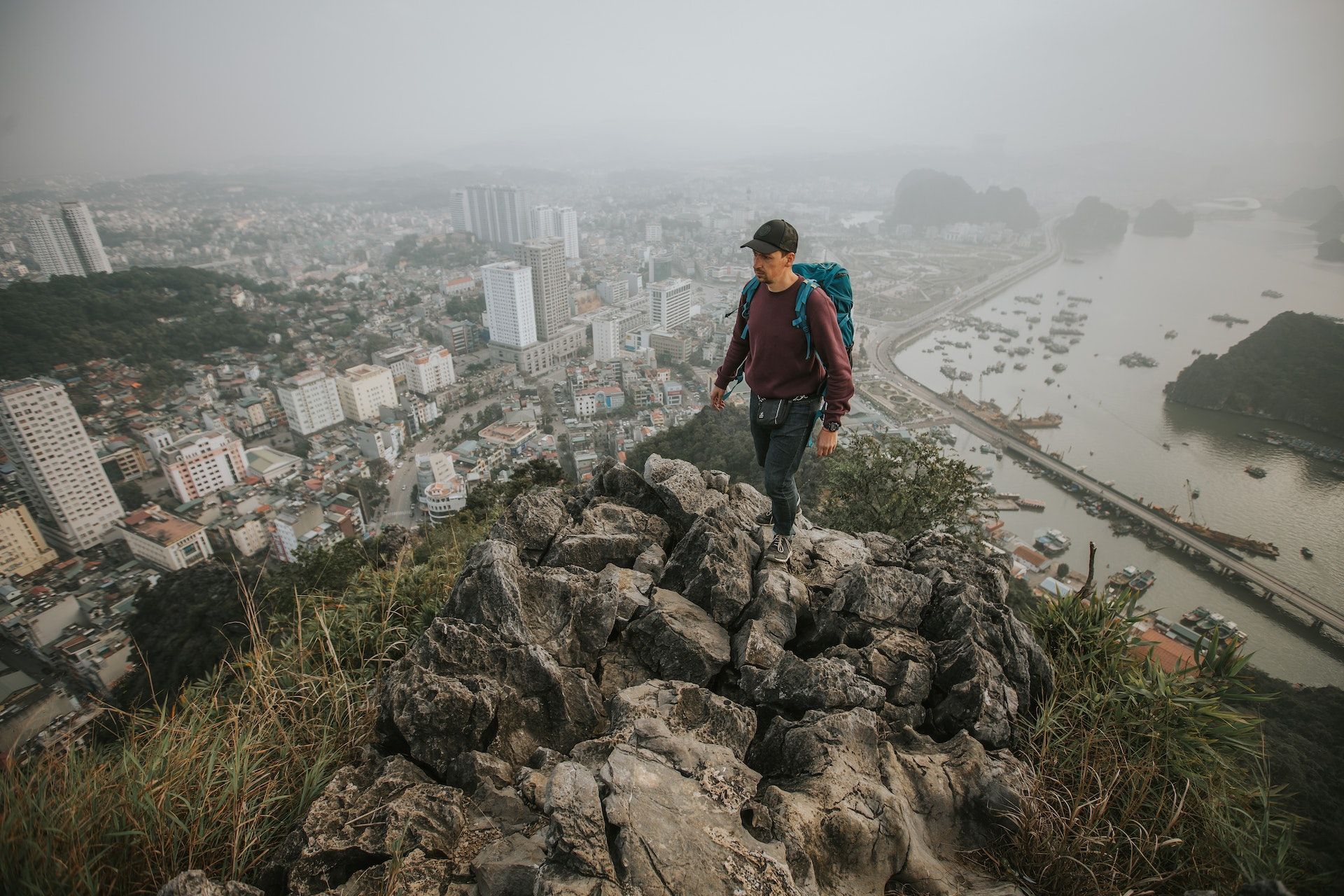 backpacker standing on rocks in Vietnam