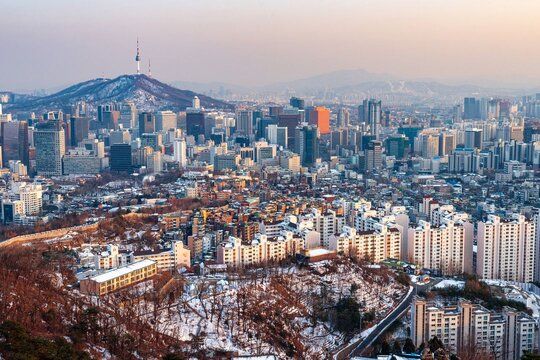Panoramic view of Seoul’s skyline and Namsan Tower during winter, featured in a guide on where to buy a SIM card in Korea.