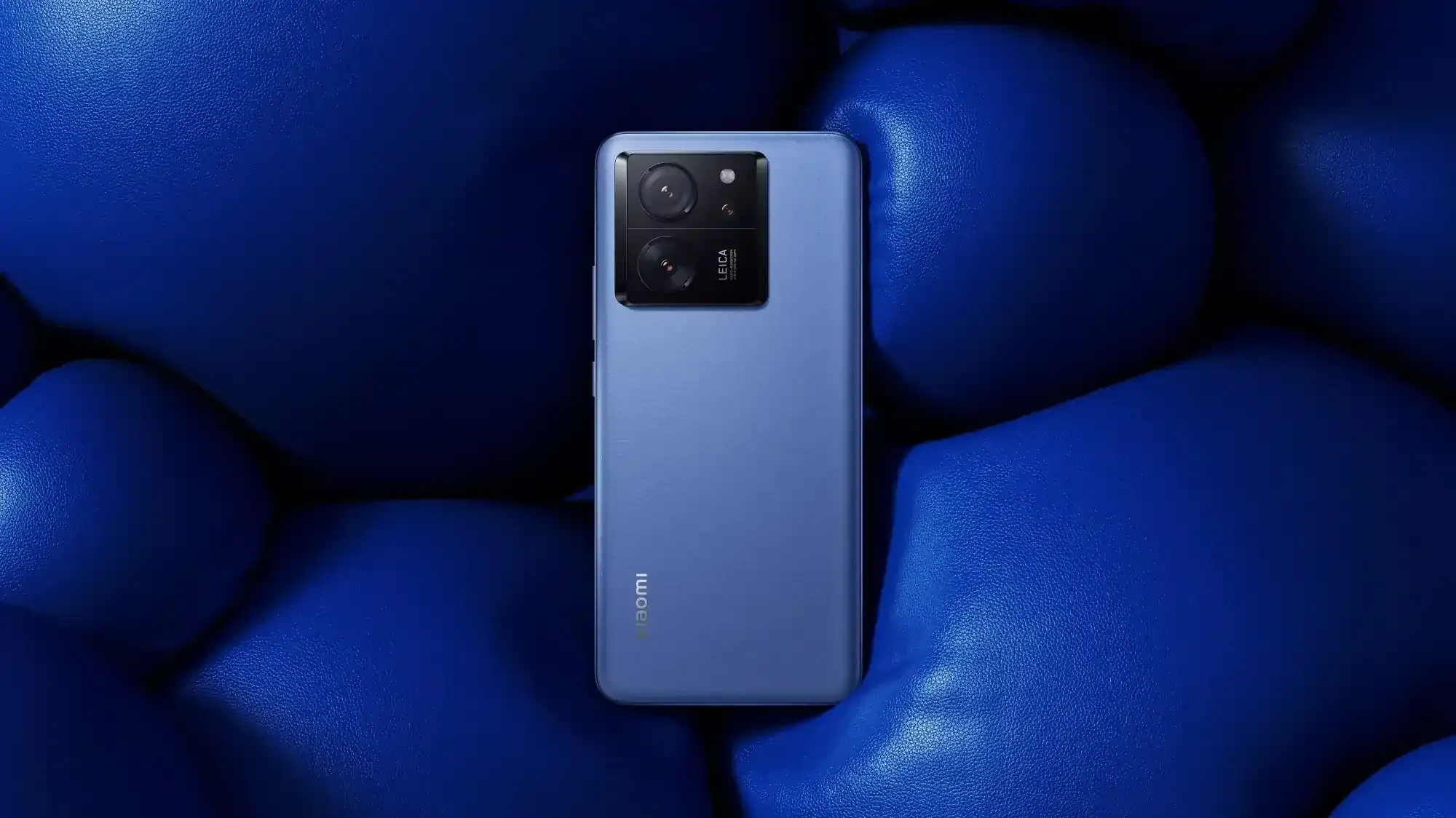 Xiaomi smartphone with Leica dual-camera design in matte blue finish — midrange eSIM-compatible phone released in 2023